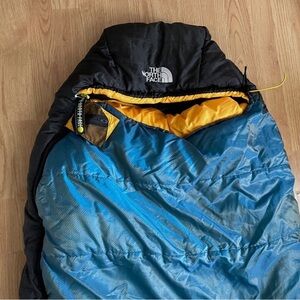 The North Face Black and Teal Sleeping Bag with Yellow Accents